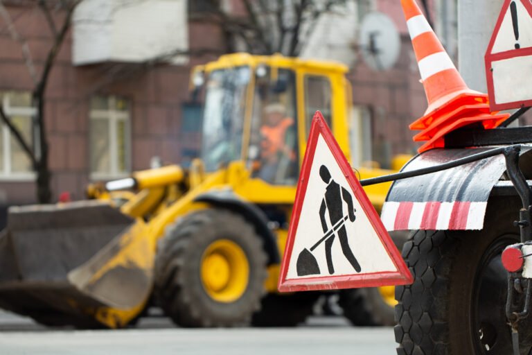 Warning street sign on road work site Warning street sign on road work site.
